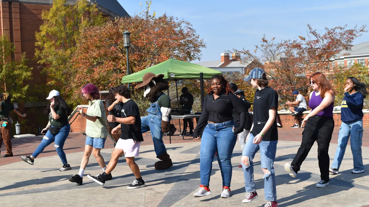 First-Generation Students line dancing at the annual cookout